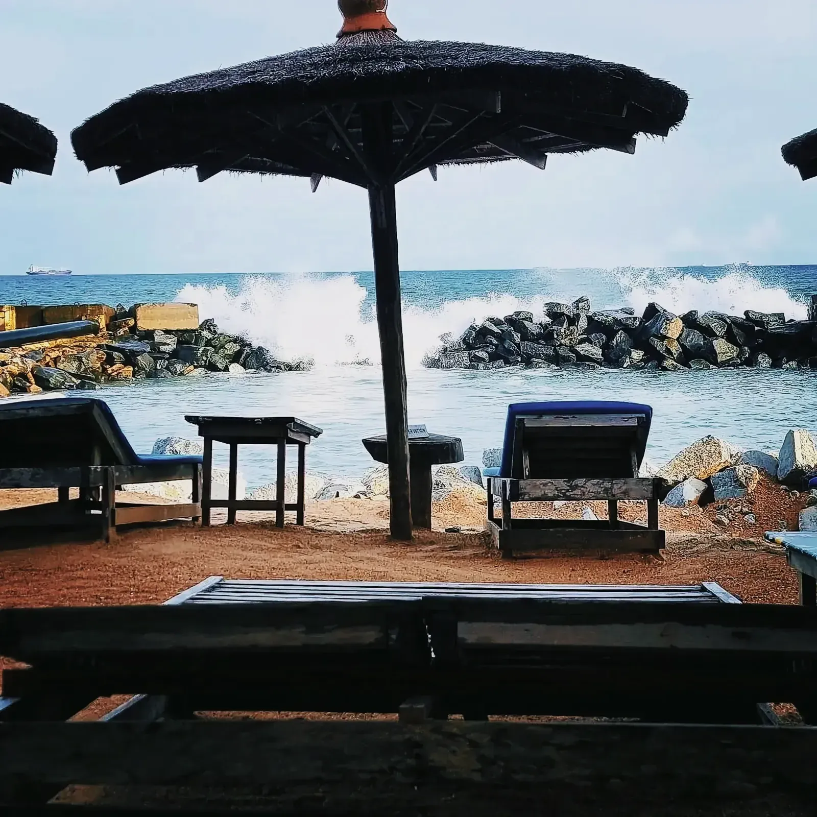 Serene beach with beach chairs and umbrellas