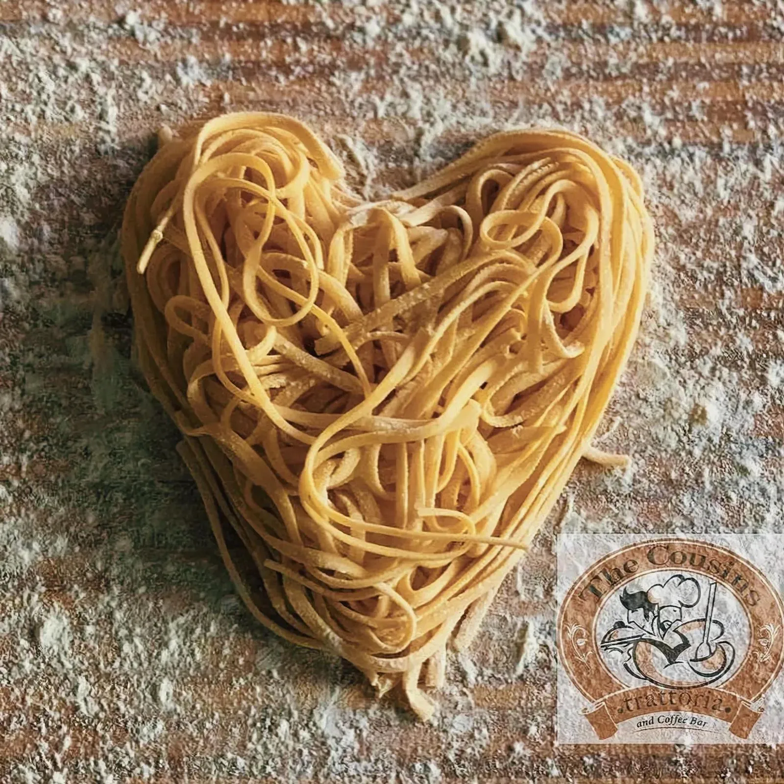 Heart-shaped pasta dish on a wooden table