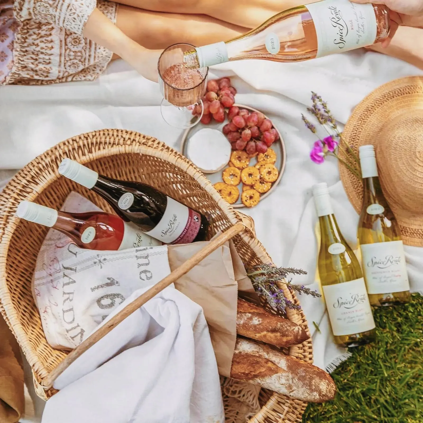 Scenic picnic setup at Spice Route Destination with wine and food.