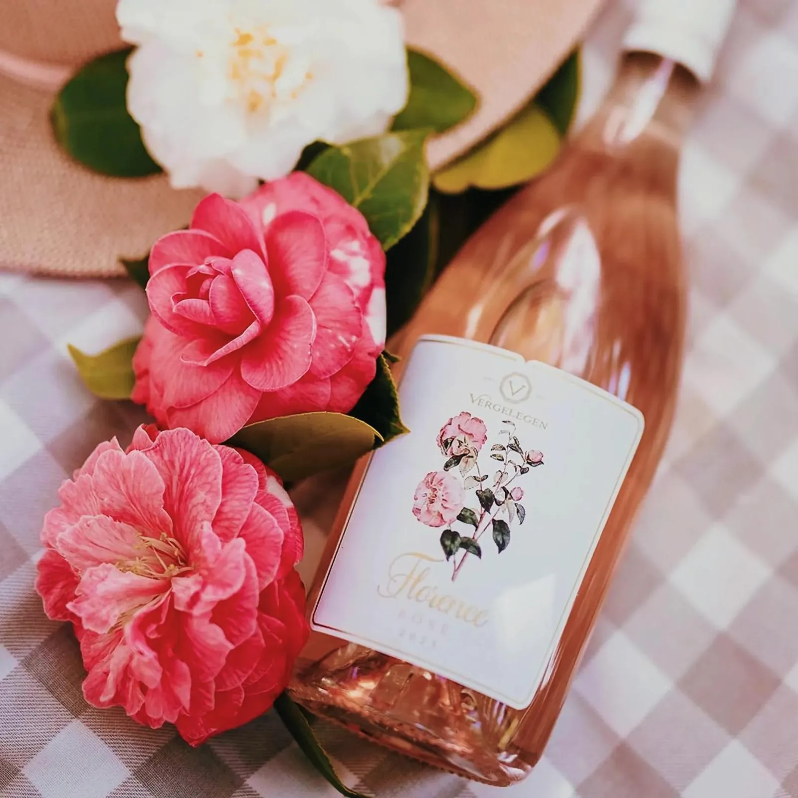 Bottle of Florence Rosé wine with floral arrangement
