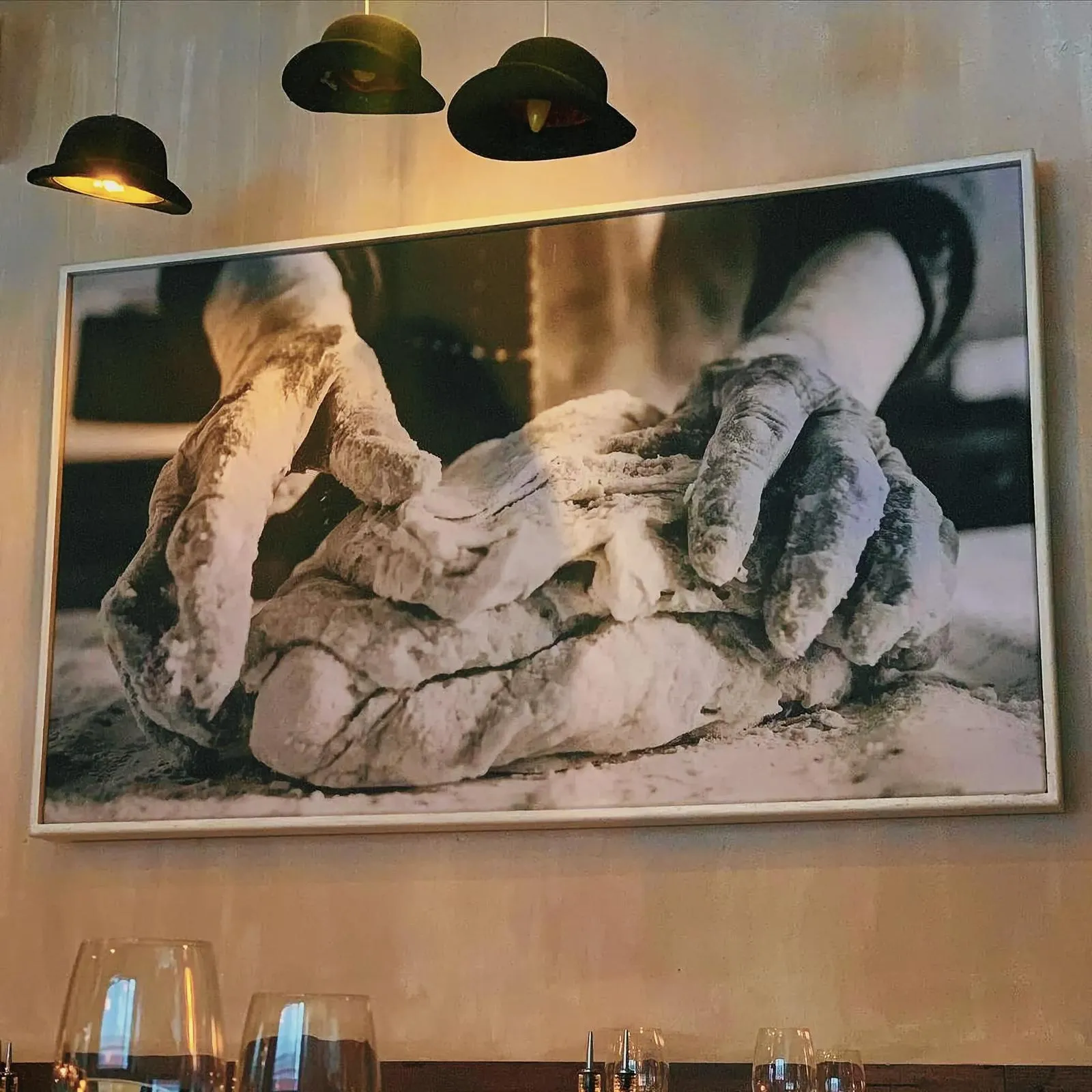Intriguing indoor art display featuring a pair of hands