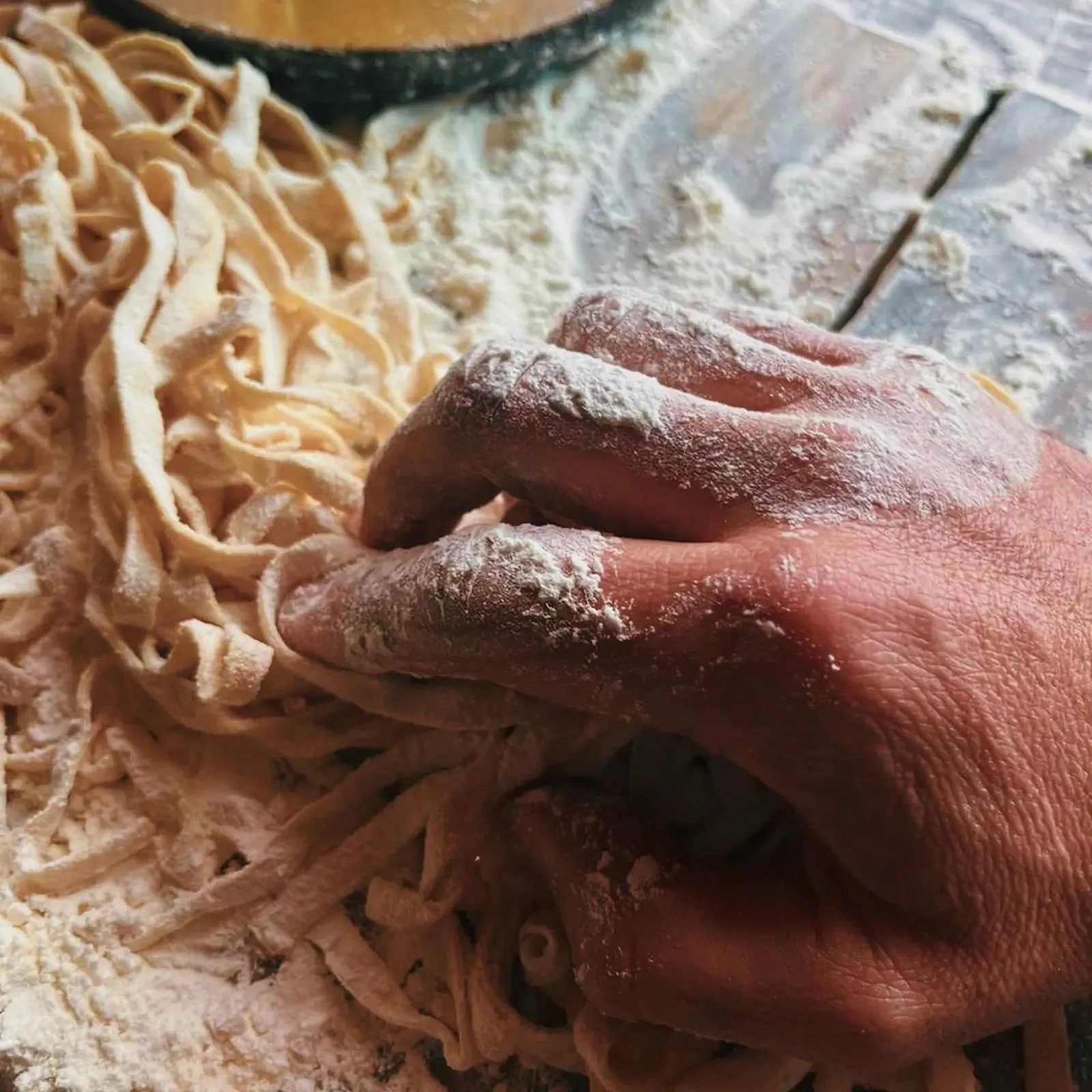 Close-up of hand making pasta at The Cousins Trattoria in Cape Town.